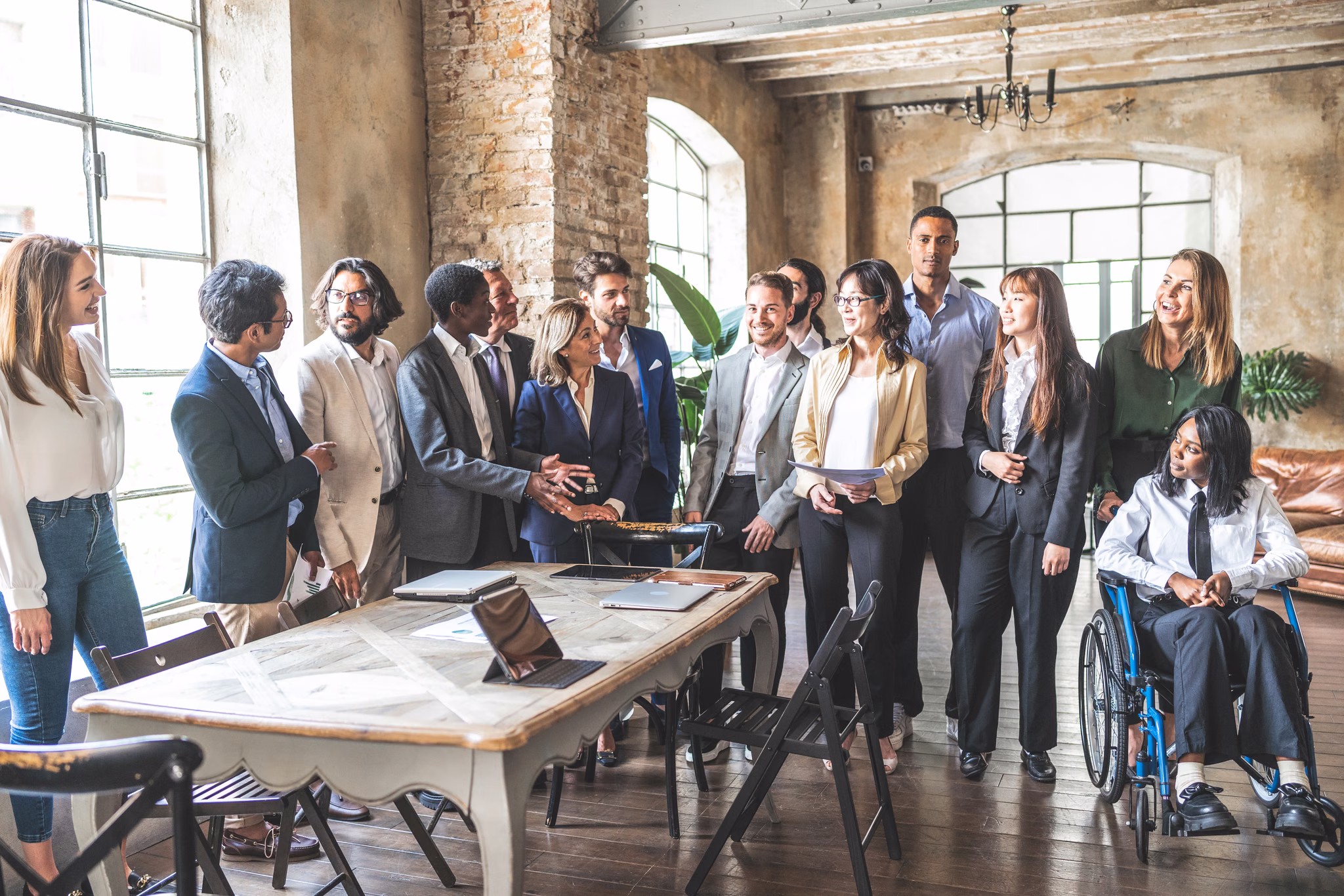 Colleagues meeting around a table in an office