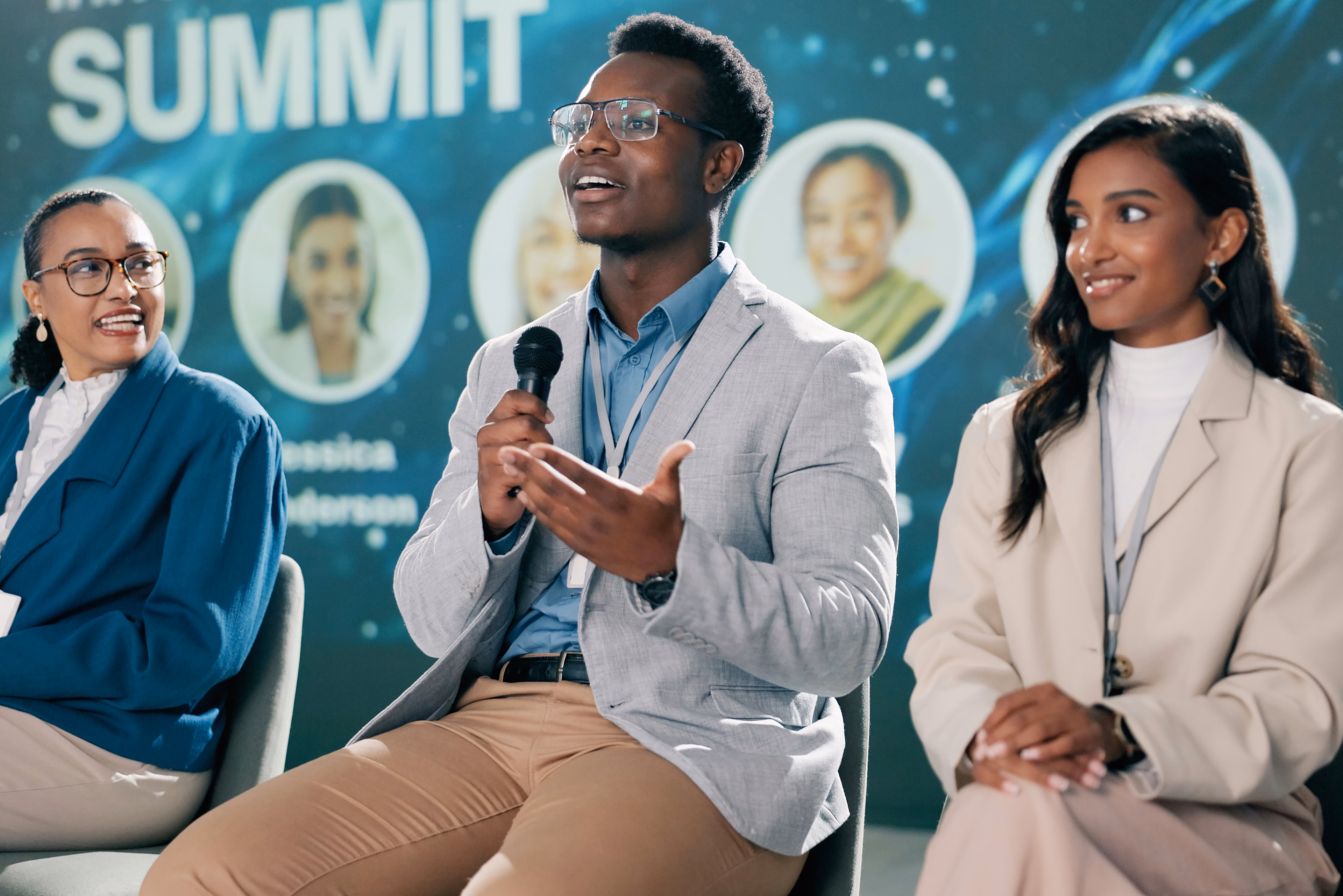 Panellists speaking at a summit