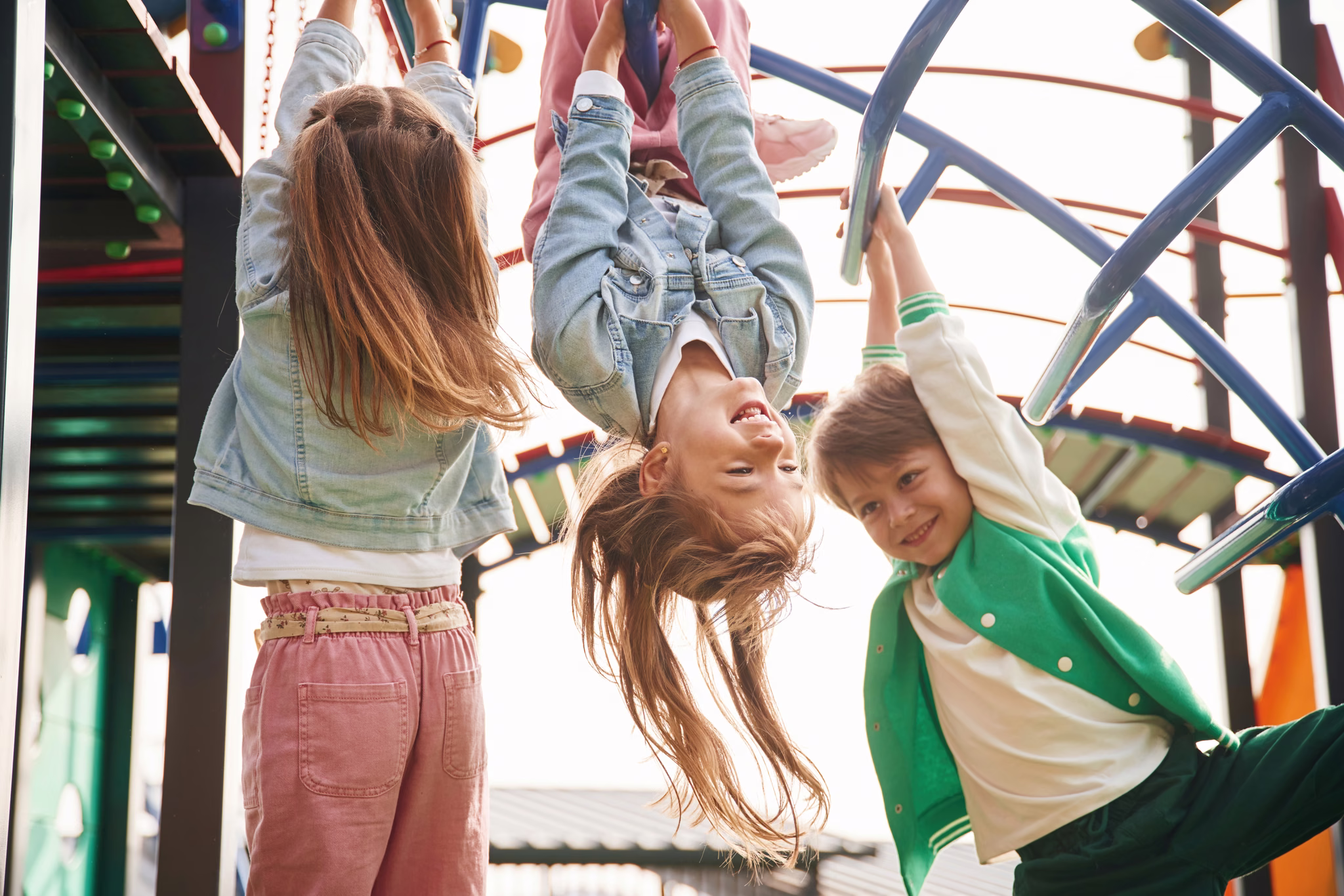 Children playing on an outdoor climbing frame