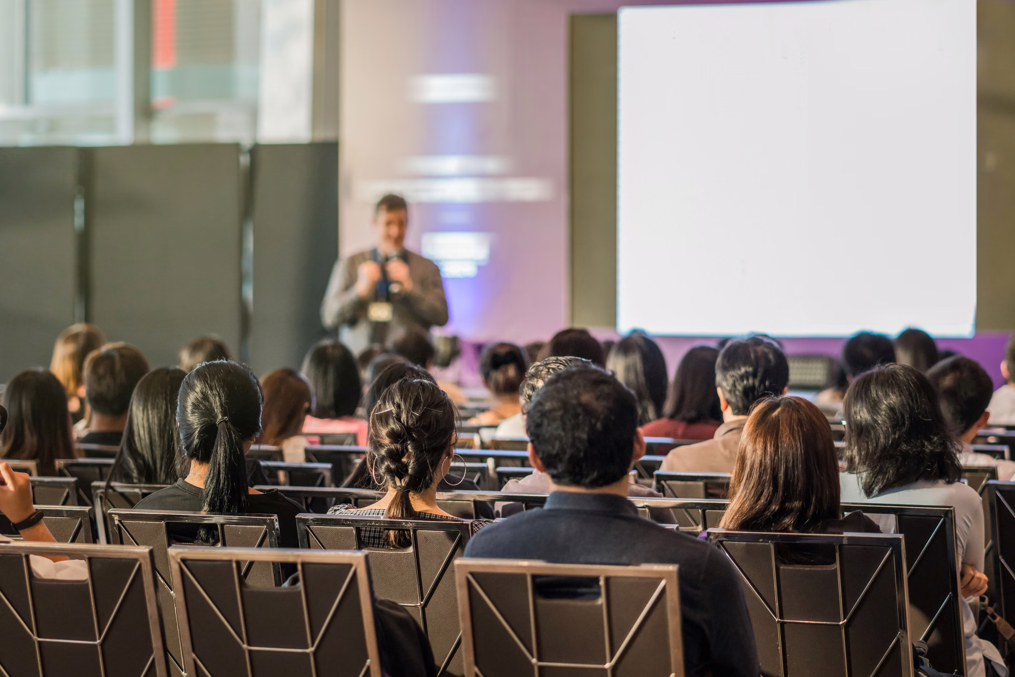 A speaker presenting at an event