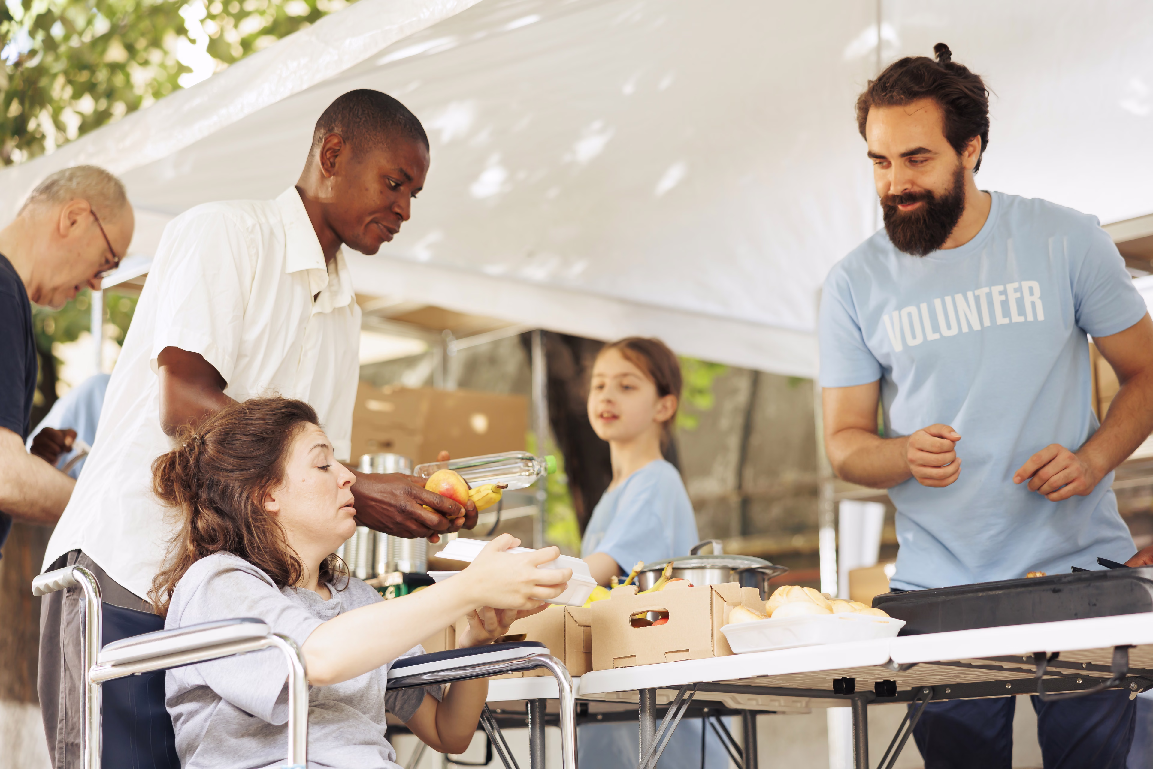 Volunteers serving food at a community event