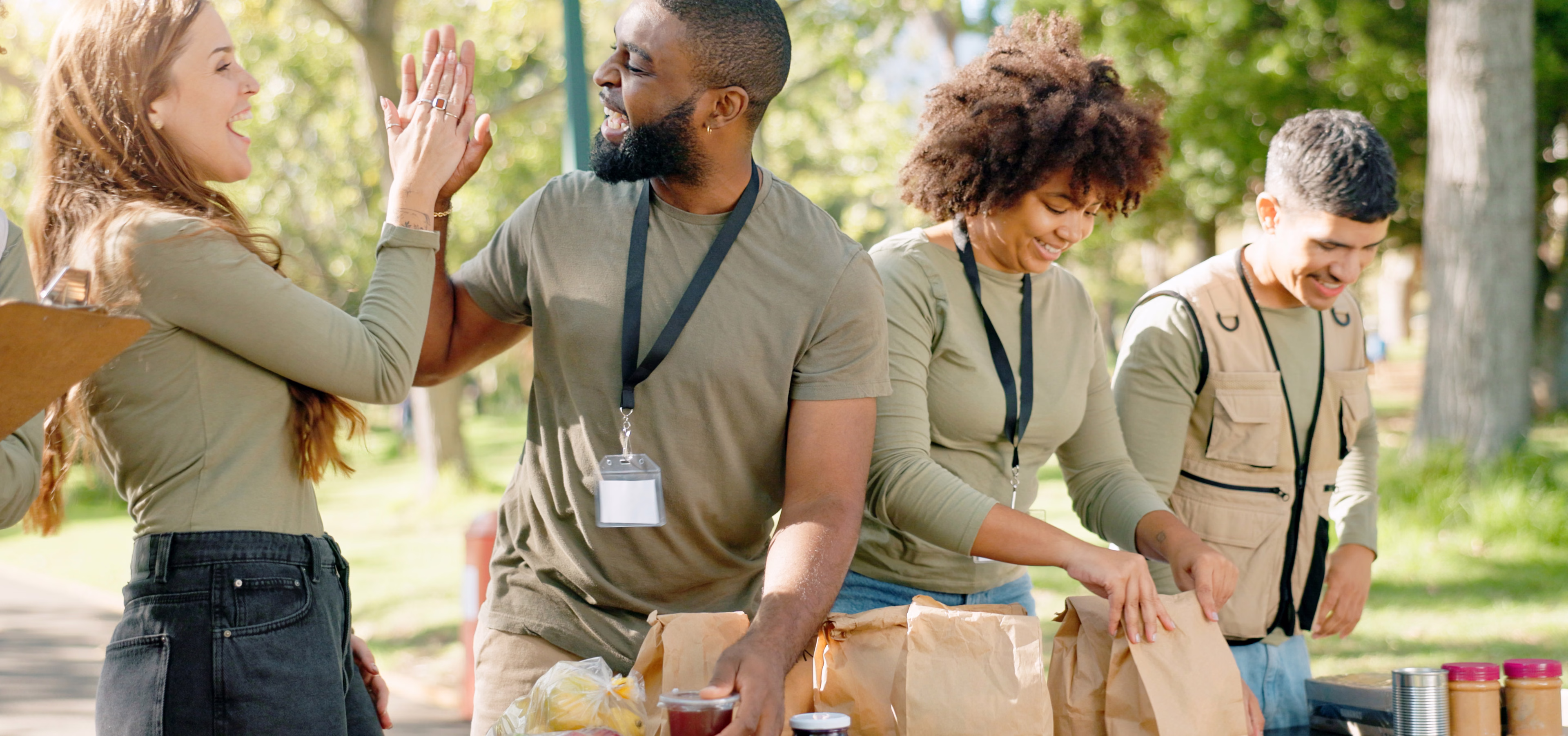 Volunteers packing bags together at a community food drive